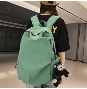 Mint green minimalist large capacity backpack, casual school rucksack with cute monkey pendant.