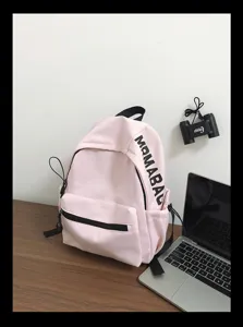 Pink casual laptop backpack detail view, featuring simple solid color design and black shoulder straps.