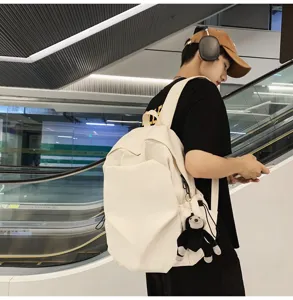 Minimalist large capacity canvas backpack for college students and daily casual streetwear.