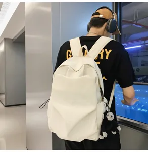 Korean minimalist large capacity white canvas backpack for university students and daily commuting.