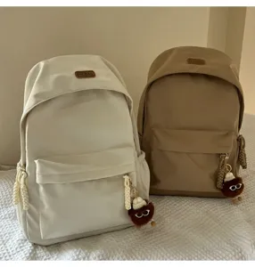 Korean style high school Harajuku backpack casual student school bag with cute keychain.