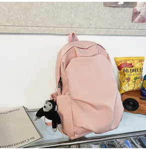 Pink casual nylon backpack with cute monkey pendant, large capacity daily school backpack for women.