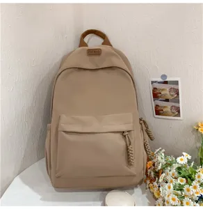 Casual minimalist backpack for students, stylish daily campus bag with front pocket.