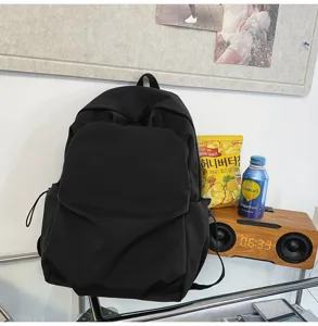 Minimalist black casual backpack, large capacity Korean style ins design for daily school use.
