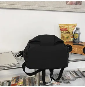 Minimalist black backpack, casual daily school bag, large capacity fashion daypack.