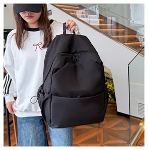 Casual solid color large capacity backpack for daily commute and school use, black backpack style.