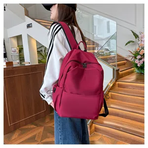 Solid color large capacity casual backpack versatile school bag for students and use.