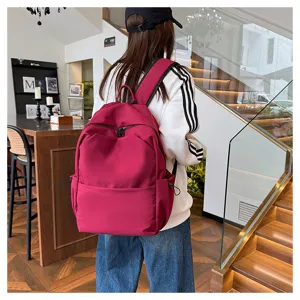 Solid color large capacity backpack casual school bag for women and men daily travel use.