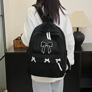 Black corduroy school backpack for women with cute white bow design casual daily use