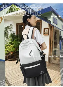 Stylish black and white contrast backpack for school and daily casual use with multiple pockets.