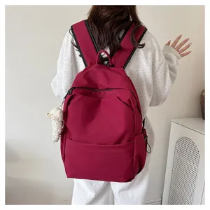 Solid color large capacity casual backpack back view detail, ideal for students daily use.