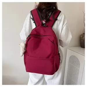 Detailed view of the solid color large capacity casual backpack showing its practical design and fabric.