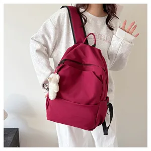 Casual solid color large capacity backpack for students, stylish and versatile school bag.