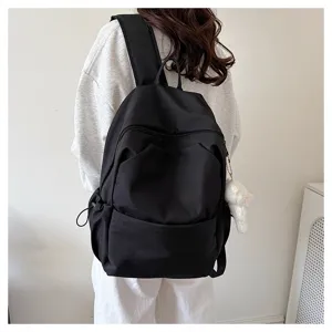 Casual solid color large capacity black backpack for students and daily commute use.