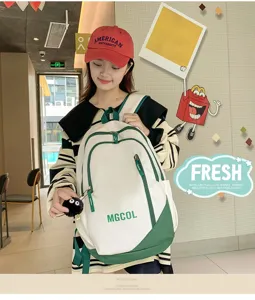 Detail view of the stylish canvas school backpack in white and green with cute keychain.