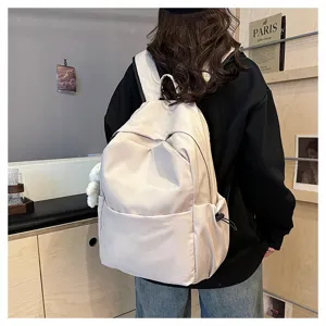 Solid color casual large capacity backpack for women and men, daily school and travel computer bag.