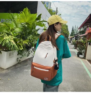 Detail view of the stylish color-block school backpack with spacious compartments.