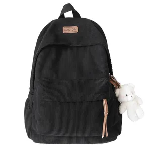 Black corduroy backpack for women and students with cute bear pendant, large capacity casual daypack.