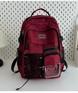 Tactical style multi-pocket student school backpack detail view, large capacity burgundy daypack.