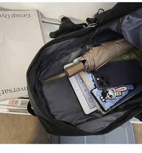 Detailed view of the large black backpack interior showing spacious storage for daily essentials.