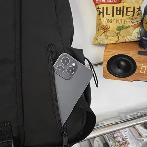 Minimalist black backpack, large capacity casual school bag for daily college and travel use.