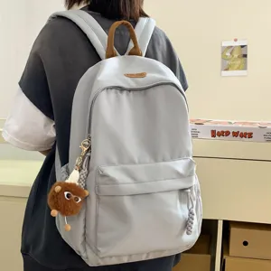 Korean style minimalist grey school backpack for students, trendy daily casual bookbag.