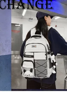 Large capacity school backpack for students, multi-compartment casual daypack with plush pendant.