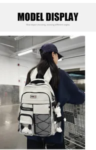Large capacity student school backpack with multi pockets and cute pendant for daily use.