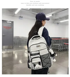 Large capacity student school backpack detail, featuring black white design and multiple practical pockets.