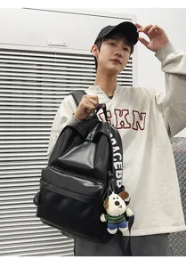 Stylish black PU leather backpack for men, casual waterproof school computer bag.