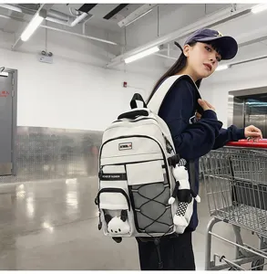 Large capacity student backpack with ergonomic spine protection design, multi-pocket school bag.