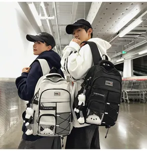 Large capacity student school backpack with cute bear pendant and multiple pockets for daily use.