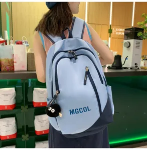 Detailed view of large capacity school backpack for students, stylish blue multi-pocket design.