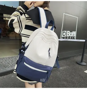 Stylish color-block campus backpack for students, casual laptop bookbag with pockets.