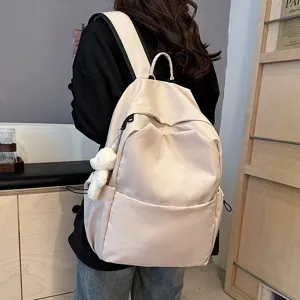 Minimalist solid color casual backpack with cute bear pendant, large capacity for daily use.