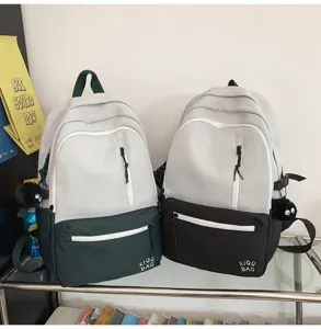 Casual color block backpack for students, stylish canvas school bag with large capacity.