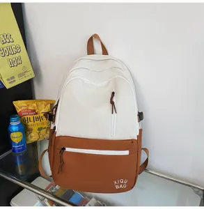 Color-block student backpack casual campus laptop bag with front zipper pocket and stylish design.