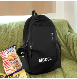 Black large capacity student school backpack with front zipper pockets, durable for daily use.