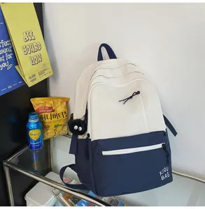 Minimalist color block campus backpack for students, stylish contrast design laptop bag casual.
