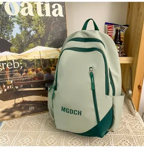 Large capacity student school backpack, stylish contrast design with multiple compartments.