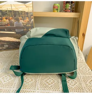 Color block student backpack with large capacity, ideal for daily school and outdoor travel use.