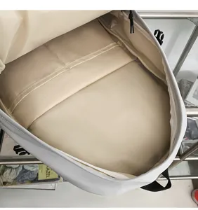 Minimalist backpack interior detail showing spacious main compartment and laptop sleeve.