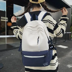 Contrast color school backpack for students, stylish casual daily laptop bag with cute charm.