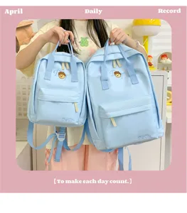 Light blue casual school backpack detail, stylish daily student daypack with front pocket.