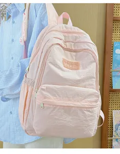 Pink casual lightweight school backpack for students, simple daily daypack with multi pockets.