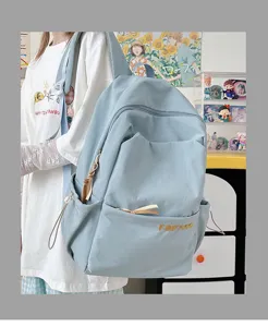 Casual minimalist light blue backpack for daily commuting, school, and outdoor travel use.