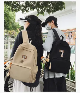 Campus large capacity solid color backpack with cute charms for students daily school use.