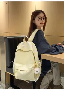 Large capacity school backpack for women, casual Japanese style daily bookbag with cute charm.