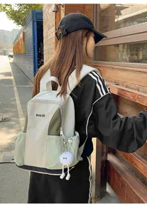 Water-resistant travel backpack for women, large capacity multi-pocket student school bag.