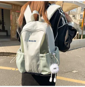 Casual waterproof canvas backpack for women and students, stylish color block travel school bag.